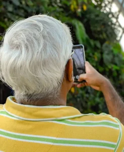a man having a video call with someone on his phone