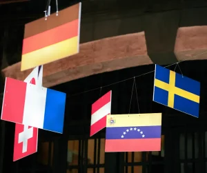different flags hanging from the ceiling