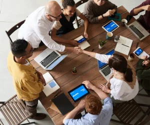 two sets of people in a business meeting